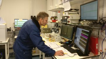 A person on a computer desk.