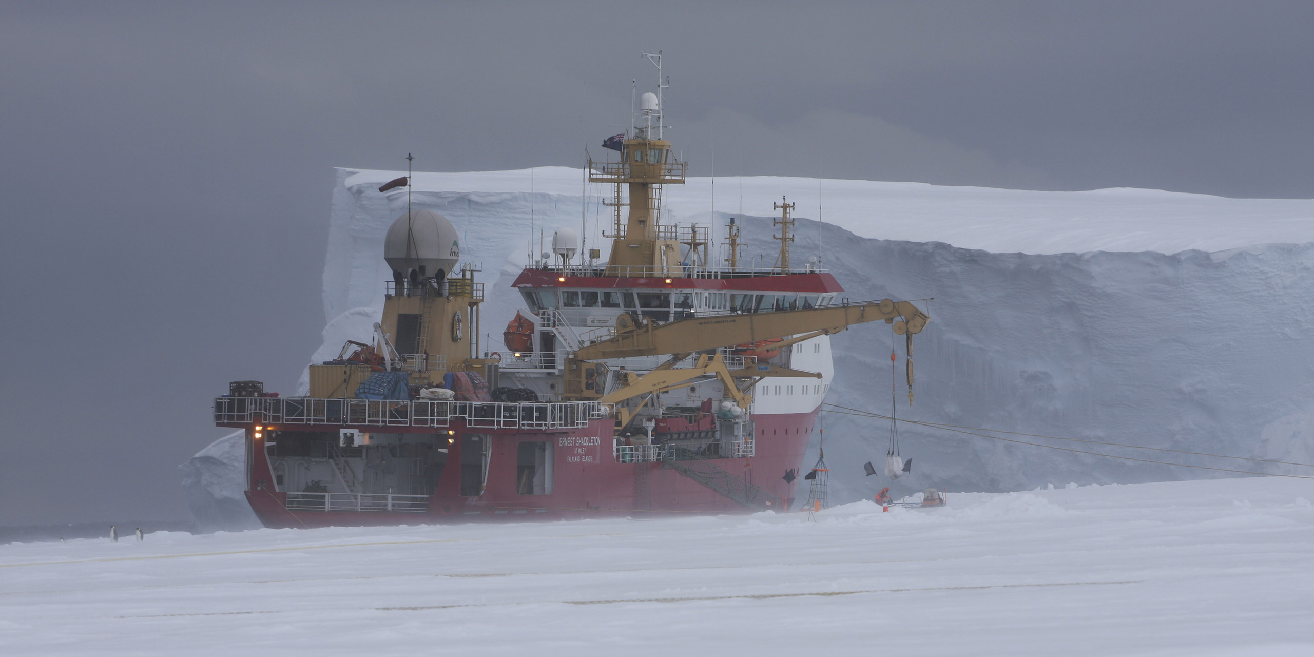 RRS Ernest Shackleton alongside the Brunt IceShelf, during a Halley Station relief