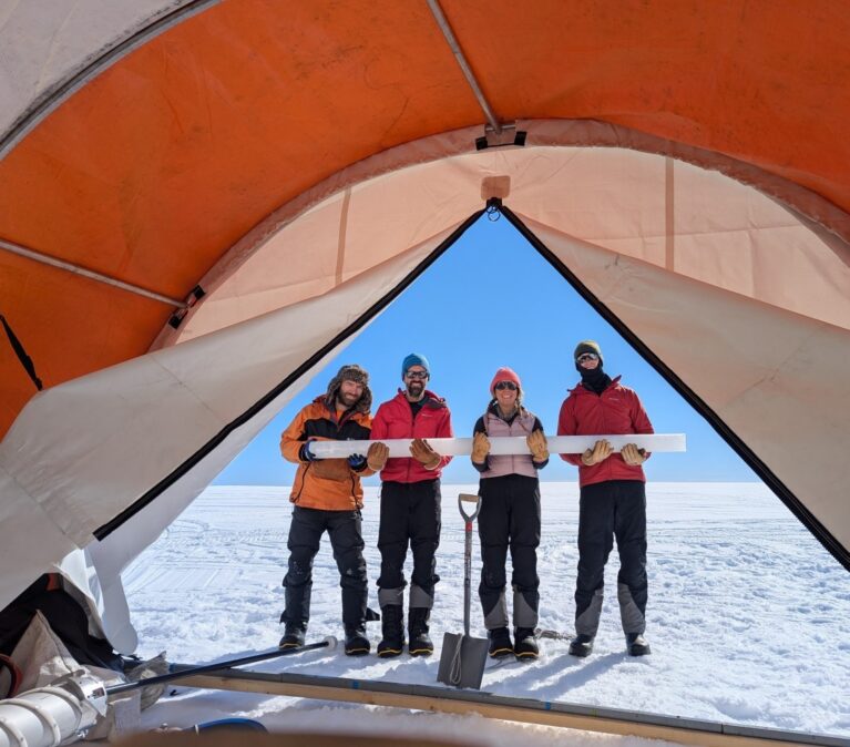 A group of people standing on a boat