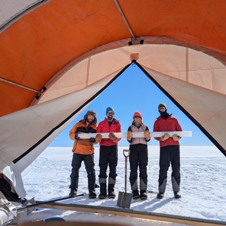 A group of people standing on a boat