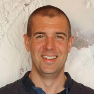 A man smiling for the camera.