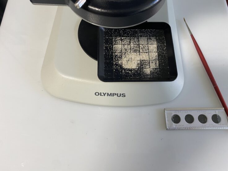 A microwave oven sitting on top of a stove