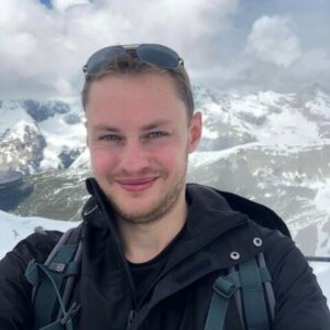 A man holding a fish posing for the camera