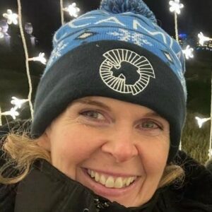 A close up of a girl wearing a hat