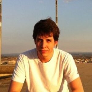 A man standing in front of a beach
