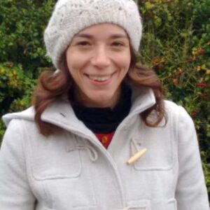 A woman smiling for the camera.