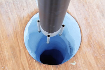 A cup of coffee sitting on top of a wooden table.