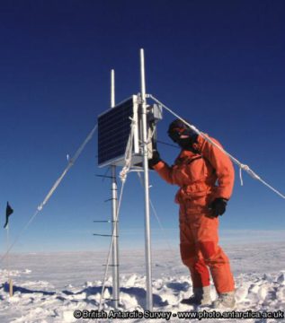 A man that is standing in the snow.