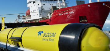 A close up of a gluder and ship.