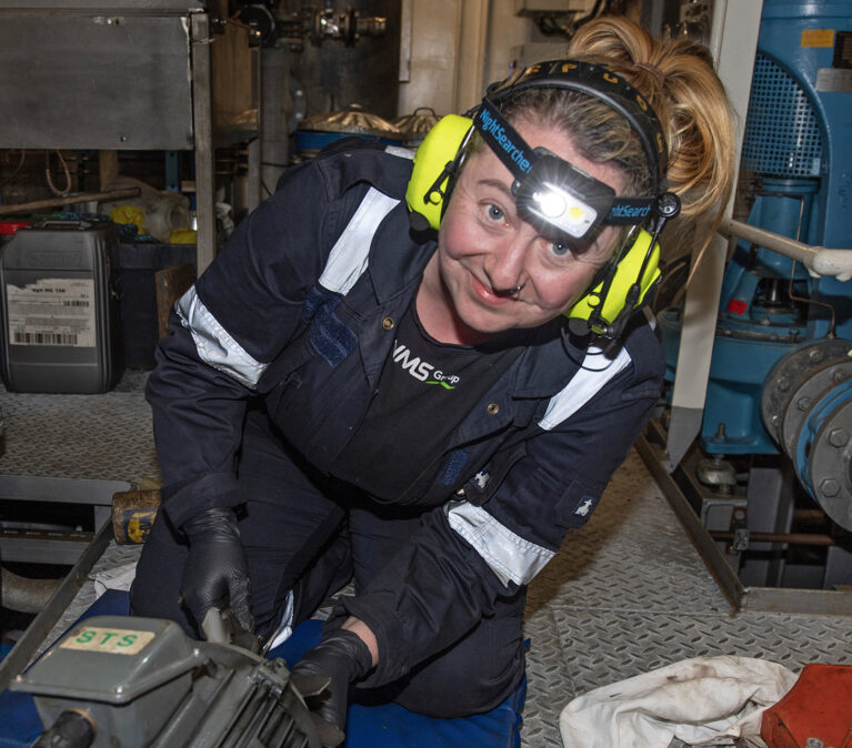 A person sitting posing for the camera