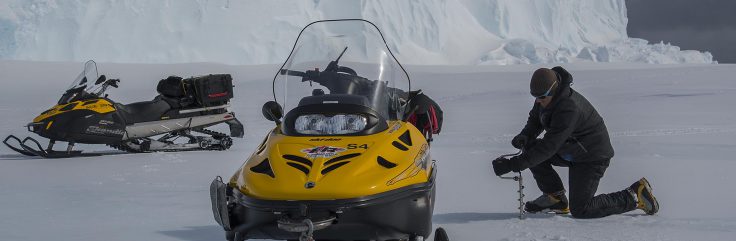 Polar Field Guide checking sea-ice thickness to ensure safe operations ahead of the ship arrival at the Brunt Ice Shelf