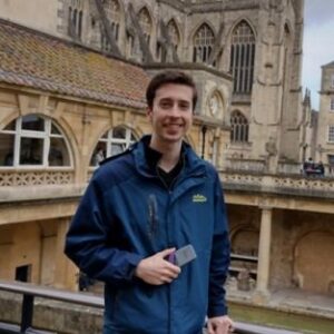 A man standing in front of a building
