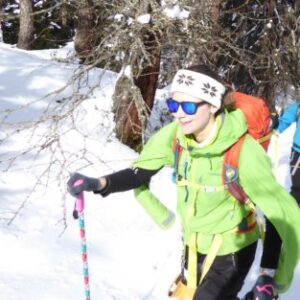 A group of people cross country skiing in the snow