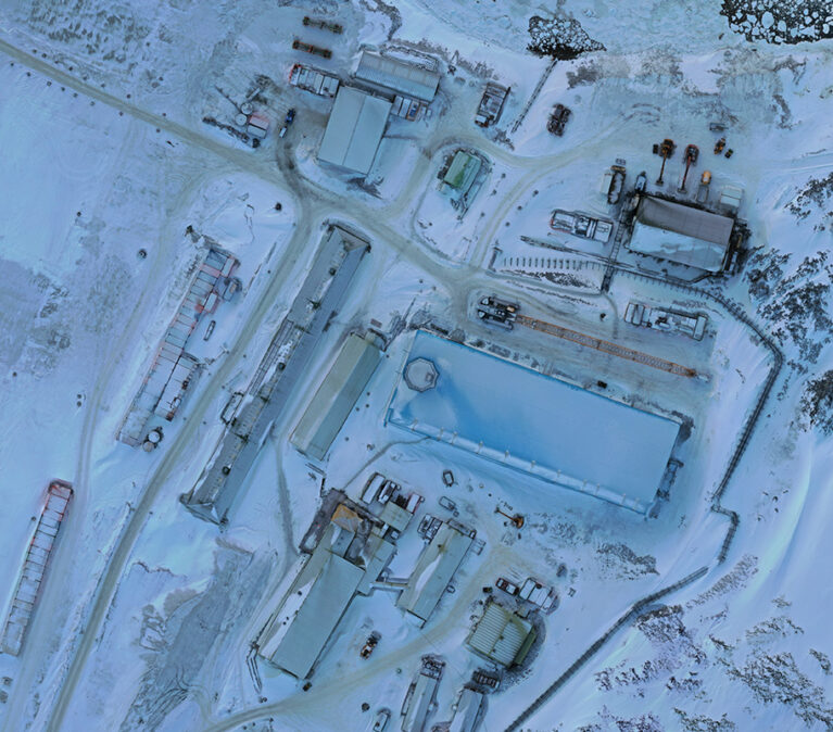 An aerial photograph of a snow blanketed research station