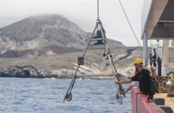 A man in a boat on a body of water