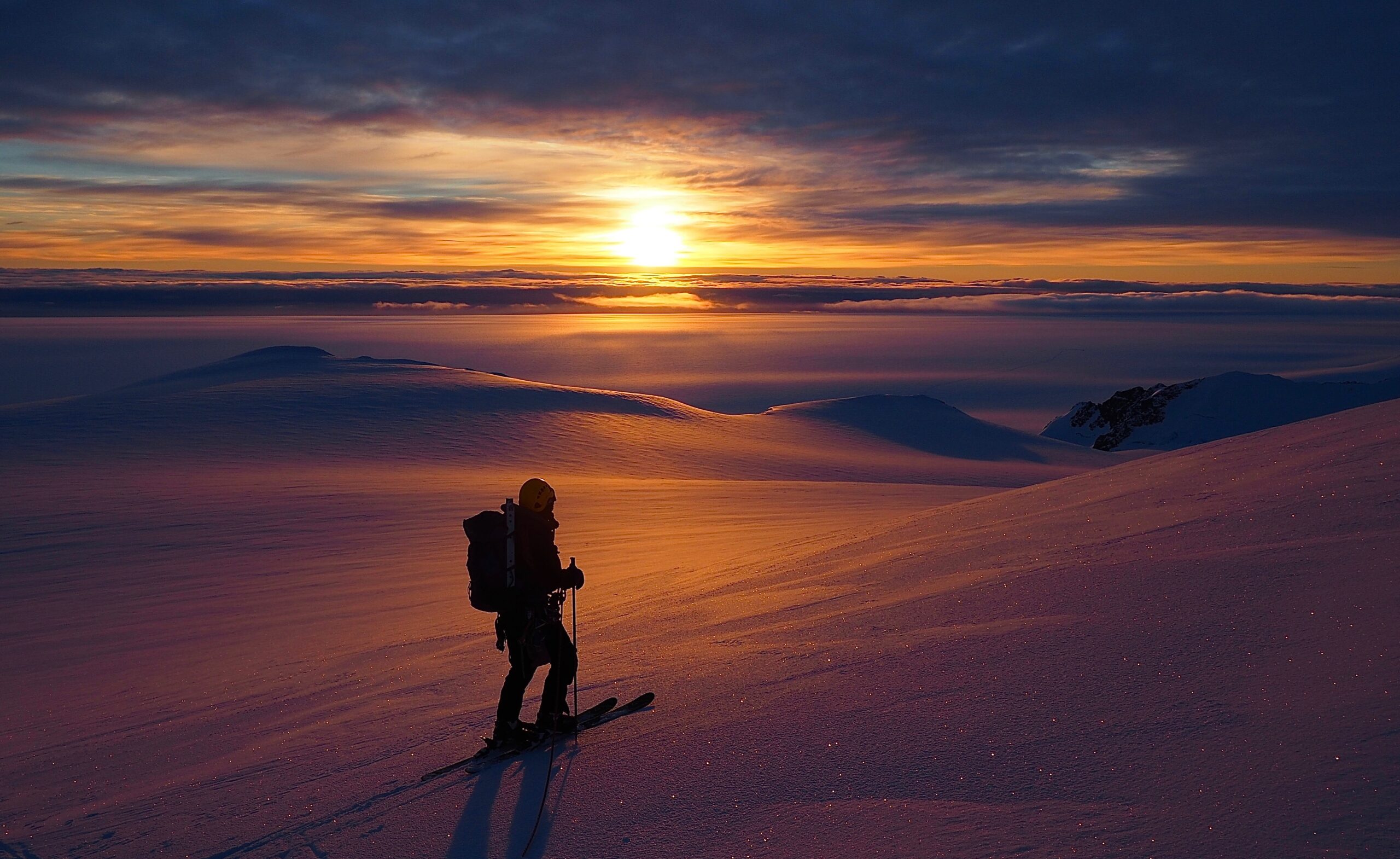 A man with a sunset in the background