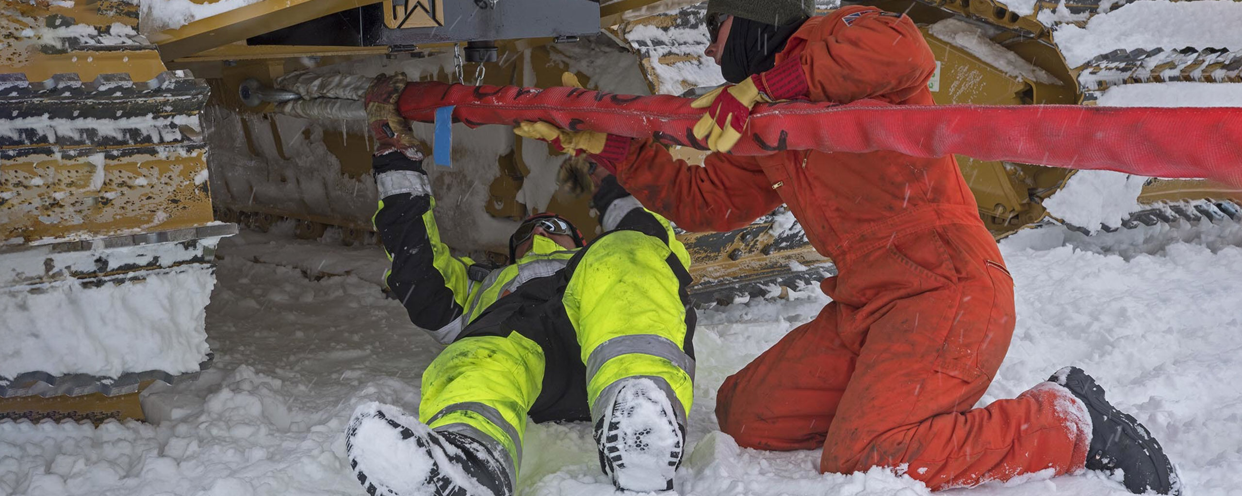 A person lying on a pile of snow
